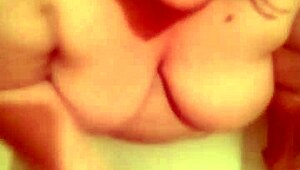 Hot bathtub blowjob and cum on those big natural tits in the bathroom!