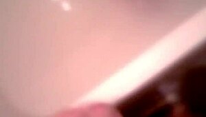 Hot bathtub blowjob and cum on those big natural tits in the bathroom!