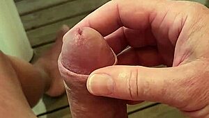 Extremely aroused guy almost finishes on mobile home terrace at campsite.