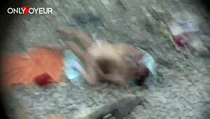 Beach voyeur catches round booty babe swallowing cum in public