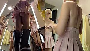 Upskirt blonde with big tits caught in public fitting room!