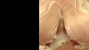 French curvy milf secretly fondles her huge breasts in the shower