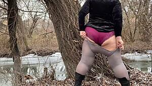 Mother-in-law flashes big panties in white pantyhose. She pees outdoors in public with huge ass.
