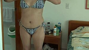Stepmom's bikini reveal on beach shocks with hairy pussy and huge tits. I couldn't look away from her taboo display.