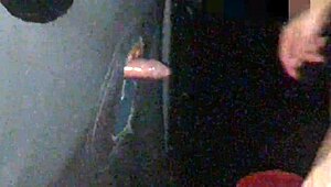 old handjob through gloryhole leads to cum on tits and jizz in cuckold cumshot scene