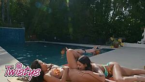 April Olsen spots Jennie Rose in a bikini and dives right in to lick her trimmed pussy