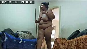 Look at that maid's huge ass and big pussy while she cleans naked!