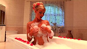 I am the blonde milf masturbating my shaved pussy in the jacuzzi, feeling every sensation