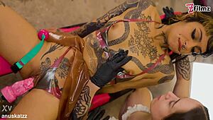 watch these goth tattooed girls dominate in lesbian femdom with ball gag and latex