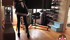 French maid bends over while vacuuming in tight skirt and stockings