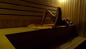 Oh my! Hidden camera catches girl fingering in sauna at night