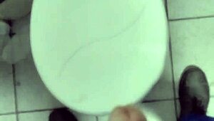 Masturbating alone at work in a solo session.