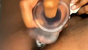 Ebony Beauty Explores Pleasure with Condom-Covered Dildo