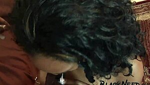 look at this ebony girl sucking a big black cock with her small tits bouncing.