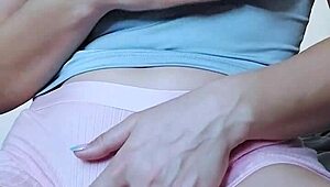 A teen girl fingers her hairy pussy to a shaking orgasm.