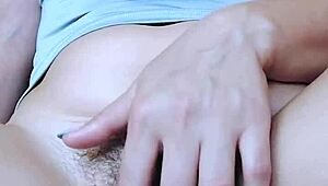 A teen girl fingers her hairy pussy to a shaking orgasm.