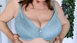 Busty granny MariaOld strips in stockings with flair cloak. See her mint lingerie and pussy close-up!