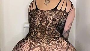 Paige in fishnets takes big black cock dildo, finishes with mouth