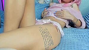 naughty petite girl fingers her wet pink pussy