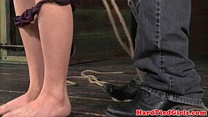 rough domination with master and submissive in bdsm scene using toys for intense sadism