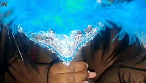 masked ebony receives a facial treatment