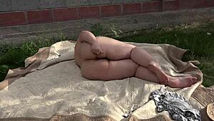 i'm out in the garden masturbating my bbw ass with a toy, shaking that big booty