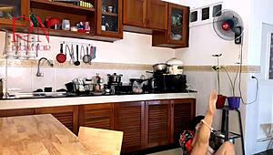 This housewife teases in pantyhose while cooking in kitchen.