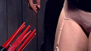 redhead in strait jacket gets tormented with whipping and choking