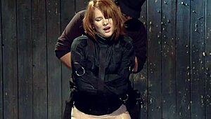 redhead in strait jacket gets tormented with whipping and choking