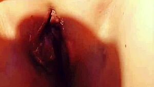 mature woman shows off her big wet vulva in close-up under skirt