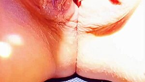mature woman shows off her big wet vulva in close-up under skirt