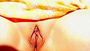 mature woman shows off her big wet vulva in close-up under skirt