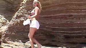 Little summer intensely shows her natural tits and pussy at the beach, getting fingered by blonde teen.