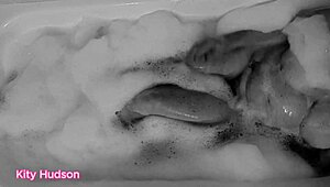 Kity Hudson plays with toy in steamy bath session