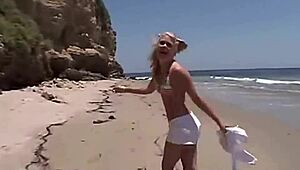Little summer intensely shows her natural tits and pussy at the beach, getting fingered by blonde teen.