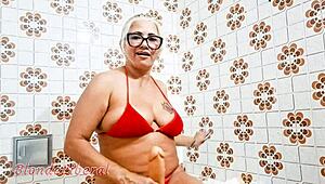 latina milf slut puts dildo in pussy and pisses in bathroom, sensual solo masturbation trailer.