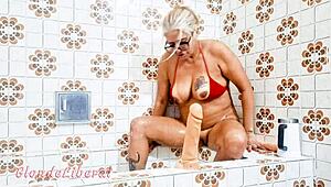 latina milf slut puts dildo in pussy and pisses in bathroom, sensual solo masturbation trailer.