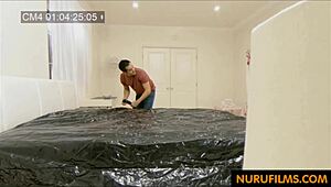 busty asian milf gives massage with handjob and blowjob in hidden nuru session