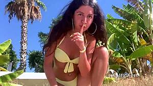 Crazy girl pees on public beach!