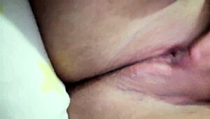 She masturbates quietly, squirting while family is nearby.