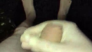 I'm masturbating in the rain, naked with my big cock out