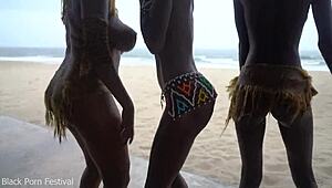 three african tribe witches perform a dancing ritual to make rain