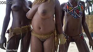 three african tribe witches perform a dancing ritual to make rain