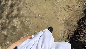 in a quiet forest after school a young angler girl sets up her fishing gear by the water enjoying the peaceful nature around her