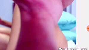 The performer engages in a hot webcam session, chatting and showing off moves