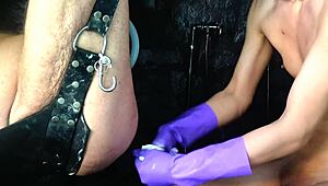 In this amateur video, a shemale undergoes relentless BDSM fisting with a big hand, loving every moment.