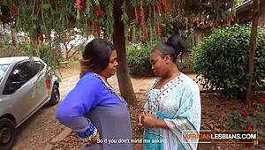 African MILF lesbians make out in public at house party