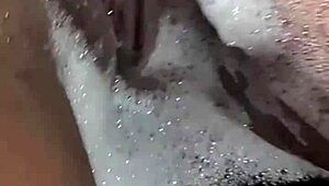 Brunette's pussy fucked in bubble bath