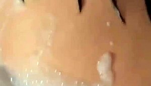 Brunette's pussy fucked in bubble bath