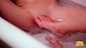 She came in and her sexy lesbian friend called her to join the bath. They licked each other's small tits in the shower.